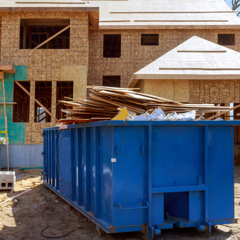 CONSTRUCTION DUMPSTER filled with construction debris